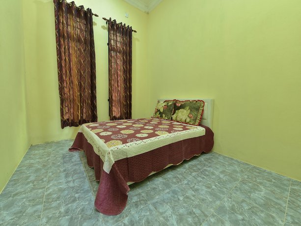 Imagen de la habitación del Hotel OYO Home 90607 Casaria Besut. Foto 15