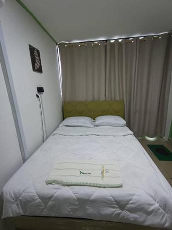 Imagen de la habitación del Hotel OYO Home 90723 Green Leaf Guest Lodge Kk. Foto 12