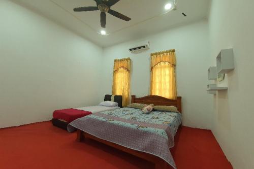 Imagen de la habitación del Hotel OYO Home 90723 Green Leaf Guest Lodge Kk. Foto 13