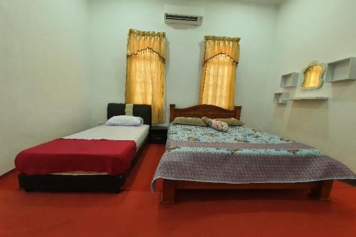 Imagen general del Hotel OYO Home 90723 Green Leaf Guest Lodge Kk. Foto 7