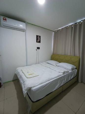 Imagen de la habitación del Hotel OYO Home 90723 Green Leaf Guest Lodge Kk. Foto 15