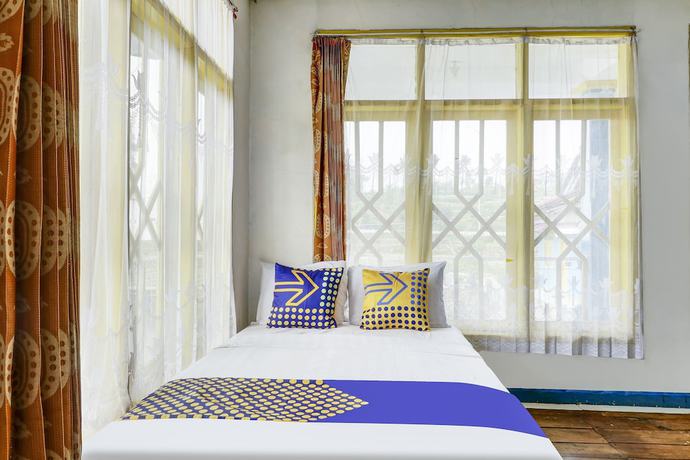 Imagen de la habitación del Hotel OYO Homes 90991 Eco Tourism Desa Panundaan Ciwidey 2 Syariah. Foto 7