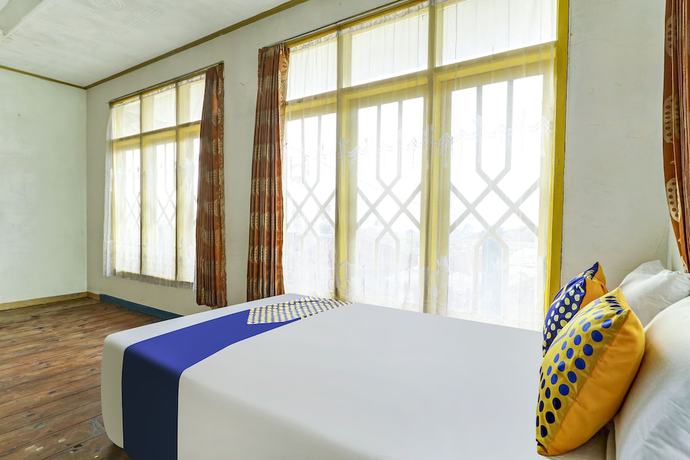 Imagen de la habitación del Hotel OYO Homes 90991 Eco Tourism Desa Panundaan Ciwidey 2 Syariah. Foto 8