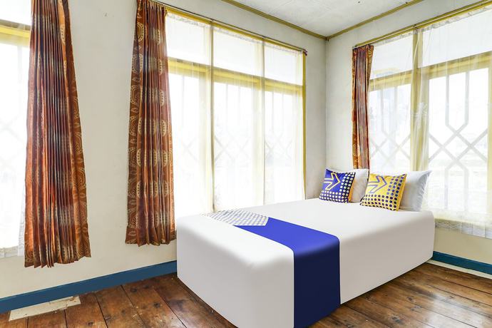 Imagen de la habitación del Hotel OYO Homes 90991 Eco Tourism Desa Panundaan Ciwidey 2 Syariah. Foto 15
