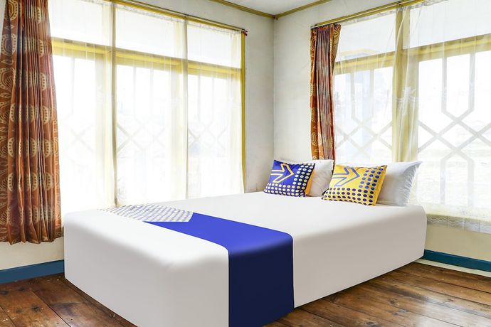 Imagen de la habitación del Hotel OYO Homes 90991 Eco Tourism Desa Panundaan Ciwidey 2 Syariah. Foto 16