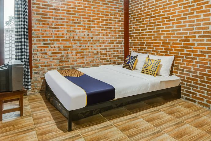 Imagen de la habitación del Hotel OYO Homes 90996 Desa Wisata Pulesari Syariah. Foto 9