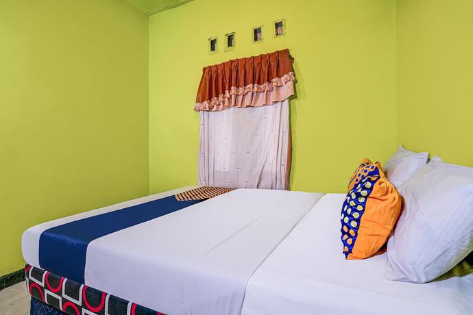 Imagen de la habitación del Hotel OYO Homes 90997 Eco Tourism Desa Cibodas Babakan Gentong 2 Syariah. Foto 7