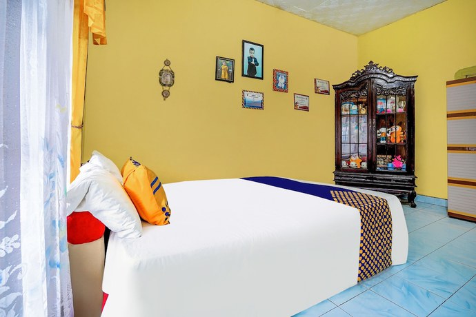 Imagen de la habitación del Hotel OYO Homes 91002 Eco Tourism Desa Cibodas Areng 3 Syariah. Foto 3