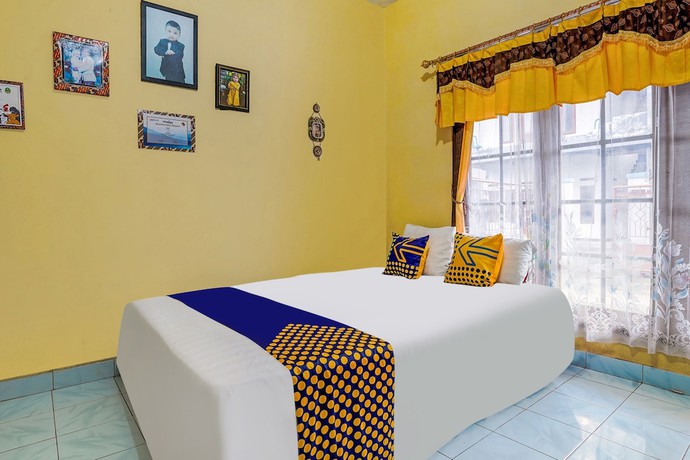 Imagen de la habitación del Hotel OYO Homes 91002 Eco Tourism Desa Cibodas Areng 3 Syariah. Foto 4