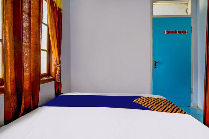 Imagen de la habitación del Hotel OYO Homes 91002 Eco Tourism Desa Cibodas Areng 3 Syariah. Foto 6