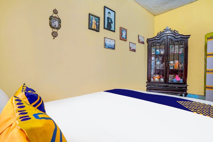 Imagen de la habitación del Hotel OYO Homes 91002 Eco Tourism Desa Cibodas Areng 3 Syariah. Foto 8