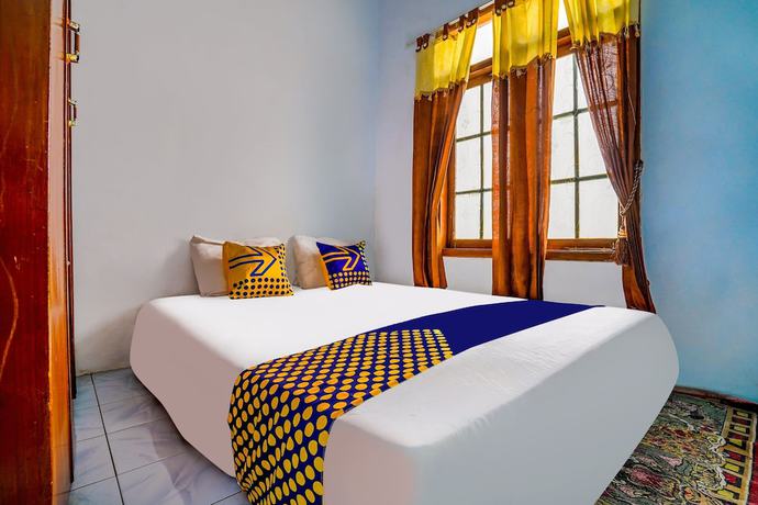 Imagen de la habitación del Hotel OYO Homes 91002 Eco Tourism Desa Cibodas Areng 3 Syariah. Foto 10