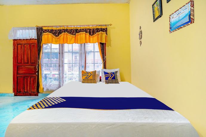 Imagen de la habitación del Hotel OYO Homes 91002 Eco Tourism Desa Cibodas Areng 3 Syariah. Foto 13