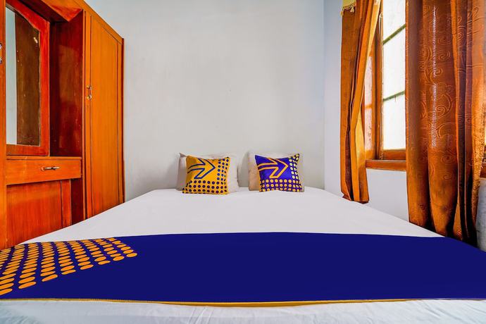 Imagen de la habitación del Hotel OYO Homes 91002 Eco Tourism Desa Cibodas Areng 3 Syariah. Foto 17