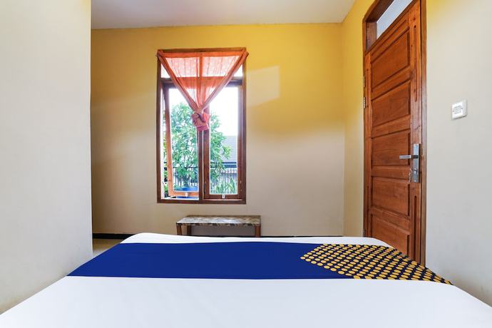 Imagen de la habitación del Hotel OYO Homes 91008 Eco Tourism Desa Cibodas Babakan Gentong 1 Syariah. Foto 4