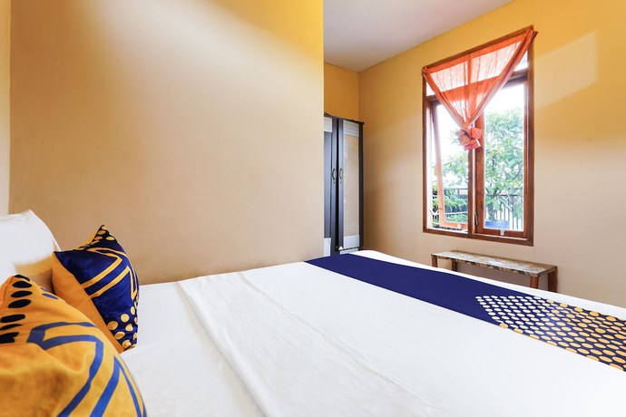 Imagen de la habitación del Hotel OYO Homes 91008 Eco Tourism Desa Cibodas Babakan Gentong 1 Syariah. Foto 7