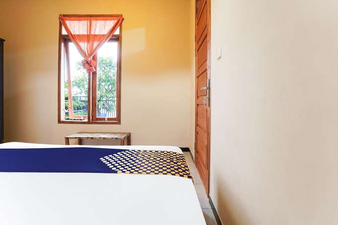 Imagen de la habitación del Hotel OYO Homes 91008 Eco Tourism Desa Cibodas Babakan Gentong 1 Syariah. Foto 9