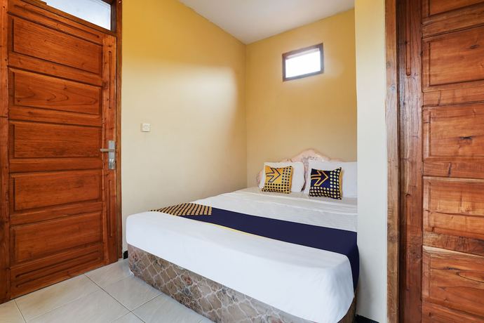 Imagen de la habitación del Hotel OYO Homes 91008 Eco Tourism Desa Cibodas Babakan Gentong 1 Syariah. Foto 11