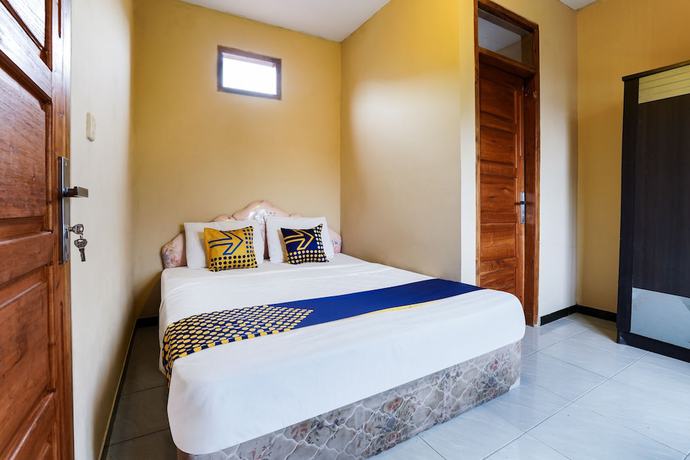 Imagen de la habitación del Hotel OYO Homes 91008 Eco Tourism Desa Cibodas Babakan Gentong 1 Syariah. Foto 12