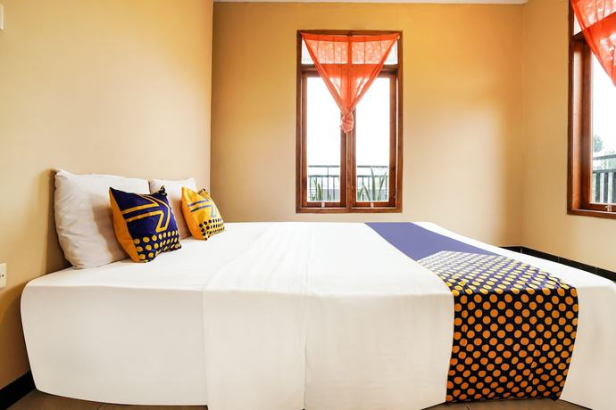 Imagen de la habitación del Hotel OYO Homes 91008 Eco Tourism Desa Cibodas Babakan Gentong 1 Syariah. Foto 13