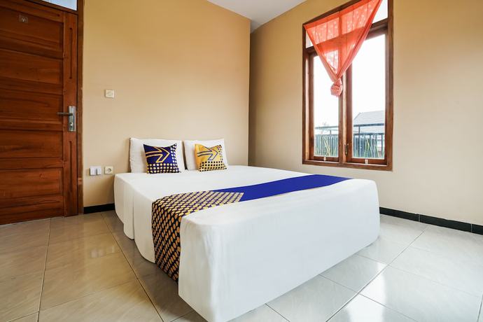 Imagen de la habitación del Hotel OYO Homes 91008 Eco Tourism Desa Cibodas Babakan Gentong 1 Syariah. Foto 14