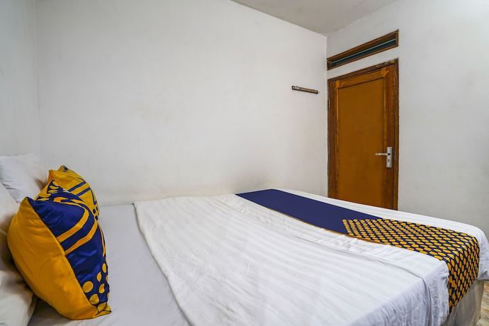 Imagen de la habitación del Hotel OYO Homes 91009 Eco Tourism Desa Cibodas Areng 4 Syariah. Foto 2