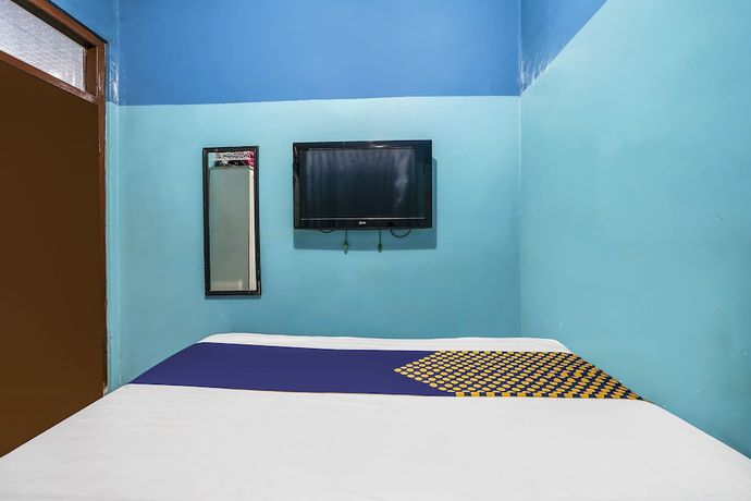 Imagen de la habitación del Hotel OYO Homes 91009 Eco Tourism Desa Cibodas Areng 4 Syariah. Foto 4