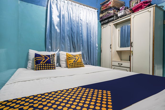 Imagen de la habitación del Hotel OYO Homes 91009 Eco Tourism Desa Cibodas Areng 4 Syariah. Foto 5