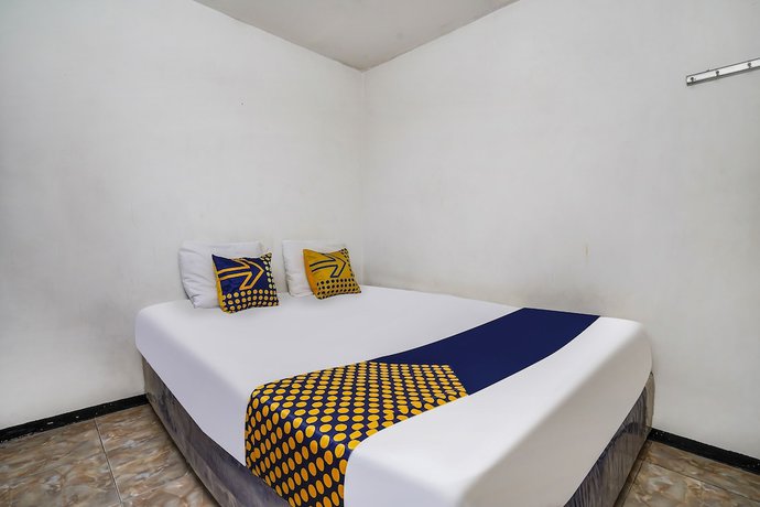 Imagen de la habitación del Hotel OYO Homes 91009 Eco Tourism Desa Cibodas Areng 4 Syariah. Foto 6