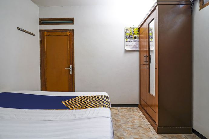 Imagen de la habitación del Hotel OYO Homes 91009 Eco Tourism Desa Cibodas Areng 4 Syariah. Foto 7