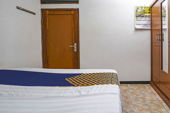 Imagen de la habitación del Hotel OYO Homes 91009 Eco Tourism Desa Cibodas Areng 4 Syariah. Foto 8