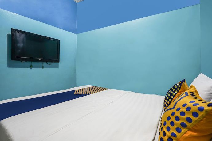 Imagen de la habitación del Hotel OYO Homes 91009 Eco Tourism Desa Cibodas Areng 4 Syariah. Foto 10