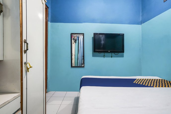 Imagen de la habitación del Hotel OYO Homes 91009 Eco Tourism Desa Cibodas Areng 4 Syariah. Foto 11