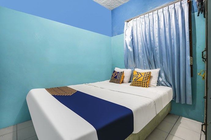 Imagen de la habitación del Hotel OYO Homes 91009 Eco Tourism Desa Cibodas Areng 4 Syariah. Foto 12