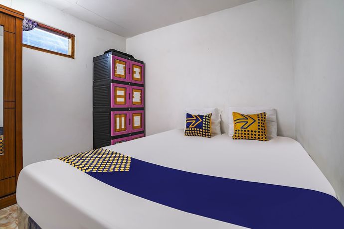 Imagen de la habitación del Hotel OYO Homes 91009 Eco Tourism Desa Cibodas Areng 4 Syariah. Foto 13