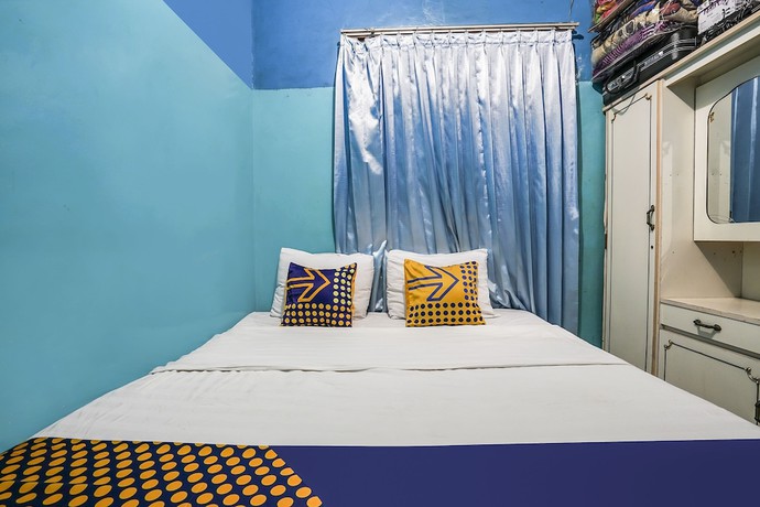 Imagen de la habitación del Hotel OYO Homes 91009 Eco Tourism Desa Cibodas Areng 4 Syariah. Foto 14