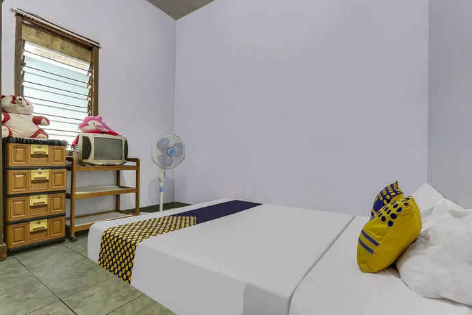 Imagen de la habitación del Hotel OYO Homes 91151 Desa Wisata Kreatif Perdamaian Srumbung Gunung. Foto 4