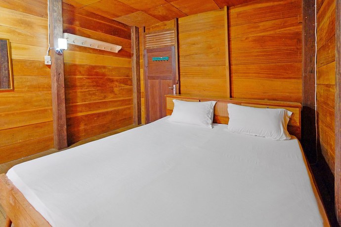 Imagen de la habitación del Hotel OYO Homes 91167 Tatto Bara Homestay. Foto 11