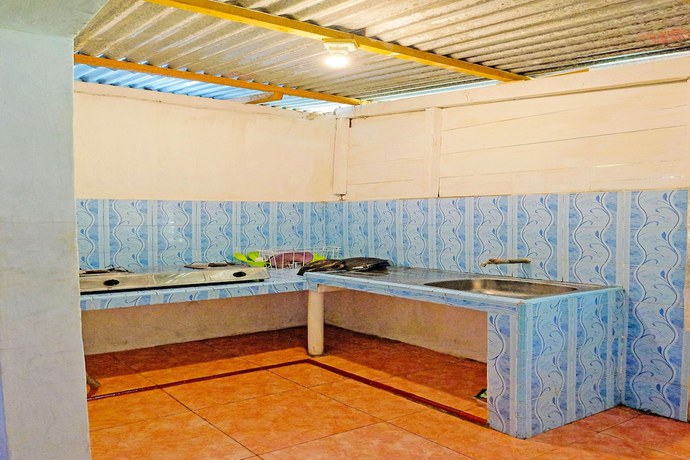 Imagen de los interiores del Hotel OYO Homes 91167 Tatto Bara Homestay. Foto 20