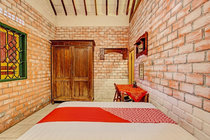 Imagen de la habitación del Hotel OYO Homes 93598 Omah Baturan Syariah. Foto 11