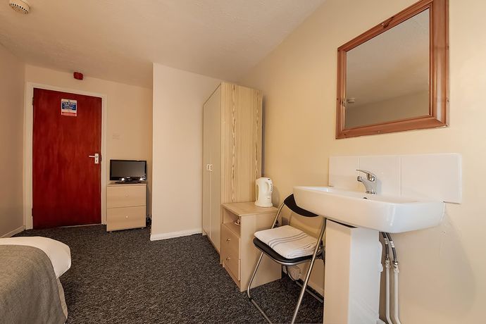 Imagen de la habitación del Hotel OYO Honeycroft Lodge. Foto 4