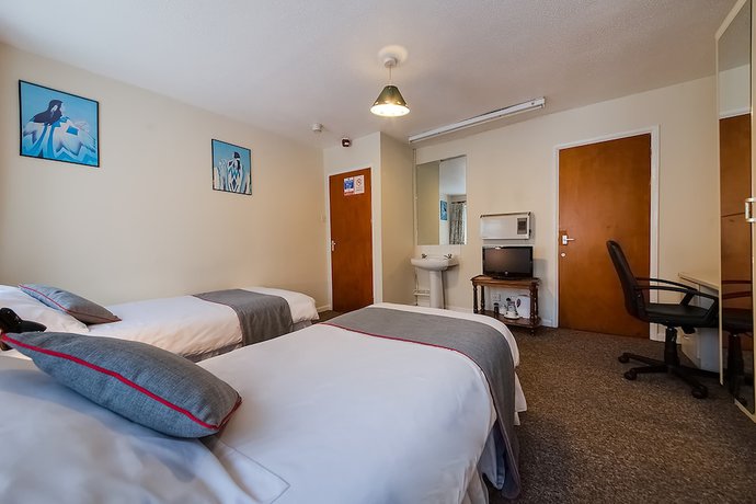 Imagen de la habitación del Hotel OYO Honeycroft Lodge. Foto 6