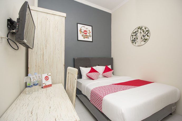 Imagen de la habitación del Hotel OYO Life 647 Irooms Homestay. Foto 11