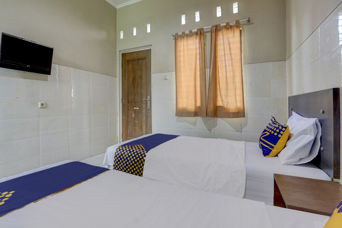 Imagen de la habitación del Hotel OYO Life 90159 Puri Asoka Guest House. Foto 9