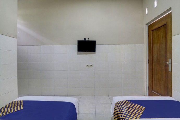 Imagen de la habitación del Hotel OYO Life 90159 Puri Asoka Guest House. Foto 10
