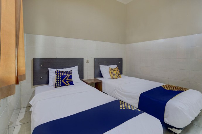 Imagen de la habitación del Hotel OYO Life 90159 Puri Asoka Guest House. Foto 11