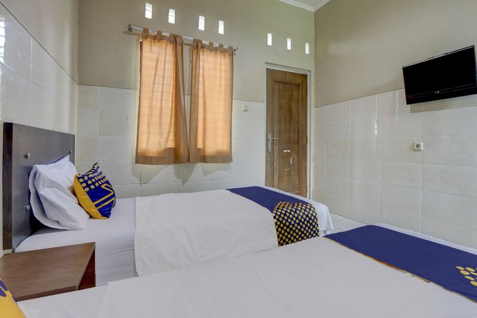 Imagen de la habitación del Hotel OYO Life 90159 Puri Asoka Guest House. Foto 14