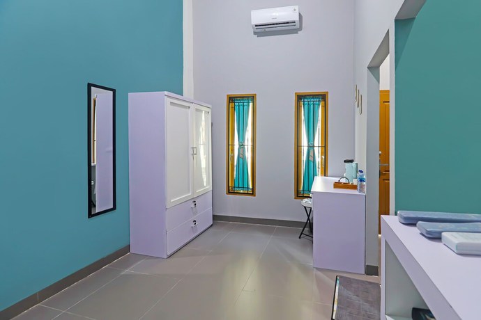 Imagen de la habitación del Hotel OYO Life 92691 Mc Kost Syariah. Foto 2