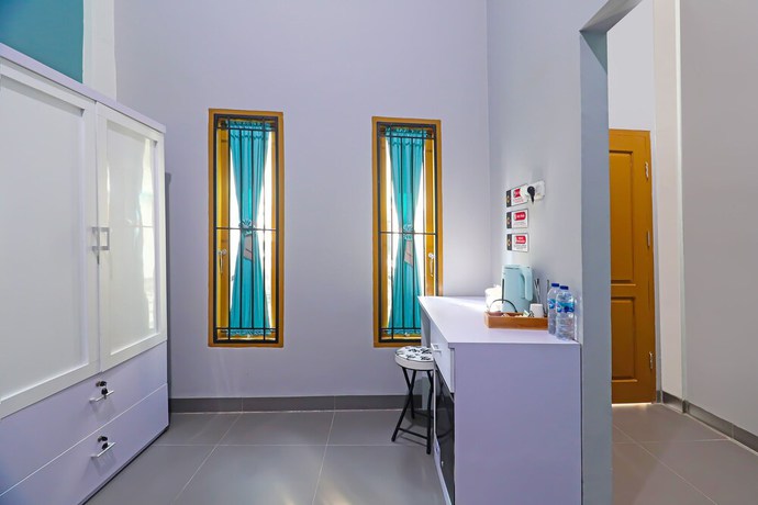 Imagen de la habitación del Hotel OYO Life 92691 Mc Kost Syariah. Foto 10