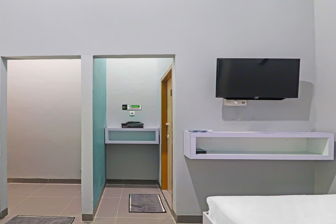 Imagen de la habitación del Hotel OYO Life 92691 Mc Kost Syariah. Foto 11